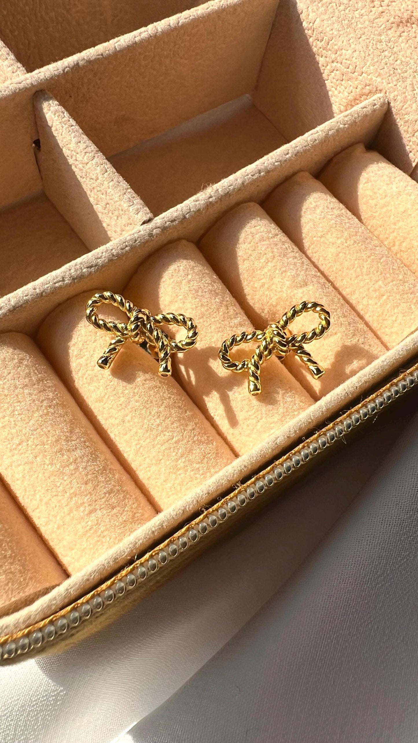 14K Gold-Plated Bow Stud Earrings: Elegant Twist Design
